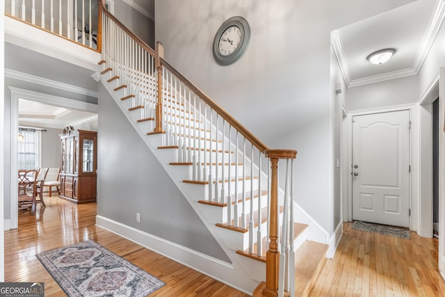 23 Raleigh Dr, Lafayette, GA 30728 - foyer entrance with wood-type flooring, stairs, crown molding, and baseboards