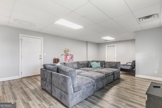 23 Raleigh Dr, Lafayette, GA 30728 - living room with light wood-style flooring, a drop ceiling, and baseboards