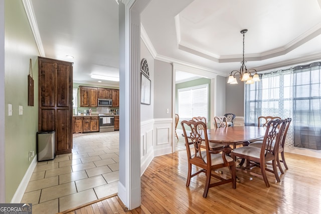 23 Raleigh Dr, Lafayette, GA 30728 - dining room with a chandelier, plenty of natural light, ornamental molding, light wood-type flooring, and a wainscoted wall
