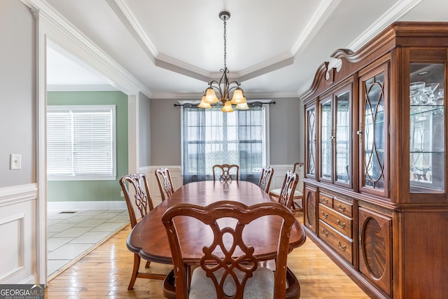 23 Raleigh Dr, Lafayette, GA 30728 - dining area featuring a chandelier, a raised ceiling, light wood-style floors, ornamental molding, and wainscoting