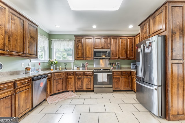 23 Raleigh Dr, Lafayette, GA 30728 - kitchen featuring appliances with stainless steel finishes, crown molding, light tile patterned flooring, recessed lighting, and light countertops