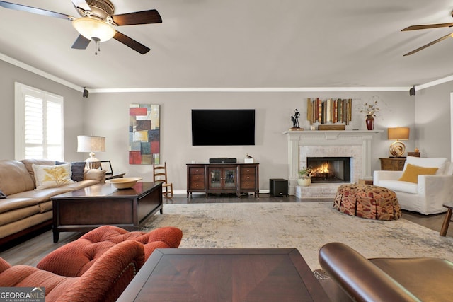 4320 Oklahoma Way NW, Kennesaw, GA 30152 - living room with ceiling fan, crown molding, wood finished floors, a tile fireplace, and baseboards