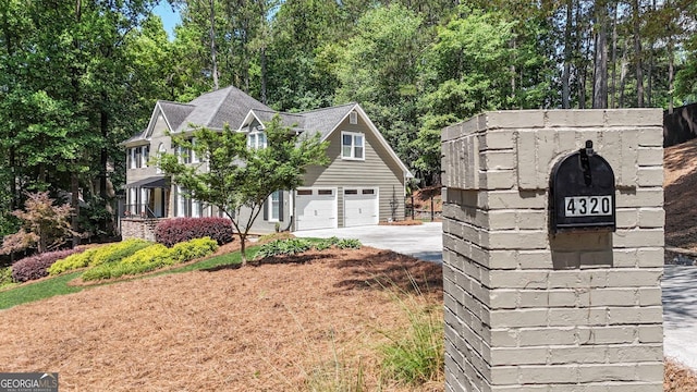4320 Oklahoma Way NW, Kennesaw, GA 30152 - view of side of property featuring driveway and a garage