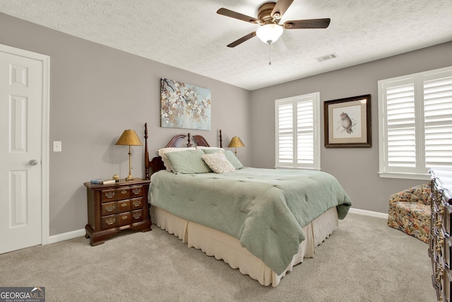 4320 Oklahoma Way NW, Kennesaw, GA 30152 - bedroom with light colored carpet, a textured ceiling, baseboards, and a ceiling fan