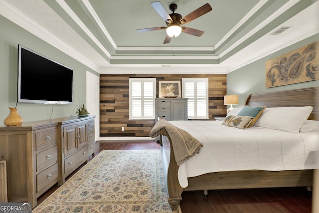 4320 Oklahoma Way NW, Kennesaw, GA 30152 - bedroom featuring a raised ceiling, wood finished floors, crown molding, wooden walls, and a ceiling fan