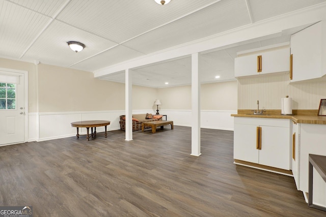 4320 Oklahoma Way NW, Kennesaw, GA 30152 - basement with dark wood-type flooring, wainscoting, and bar