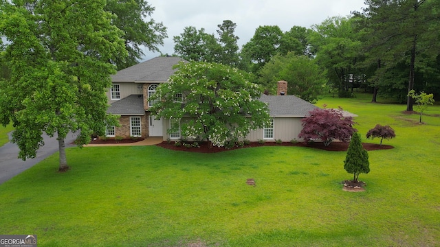 142 Carr Rd, Lagrange, GA 30241 - view of front of home with a front lawn, roof with shingles, and a chimney