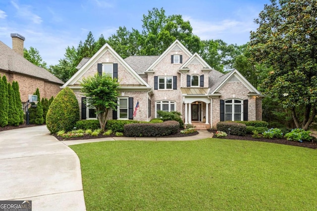 8970 Moor Park Run, Duluth, GA 30097 - view of front facade featuring brick siding and a front yard