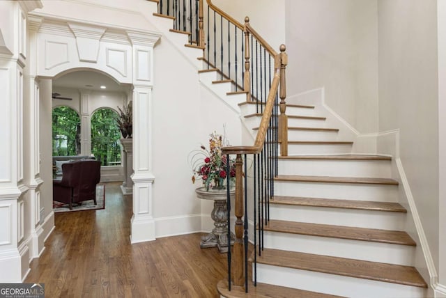 8970 Moor Park Run, Duluth, GA 30097 - stairway featuring ornate columns and wood finished floors