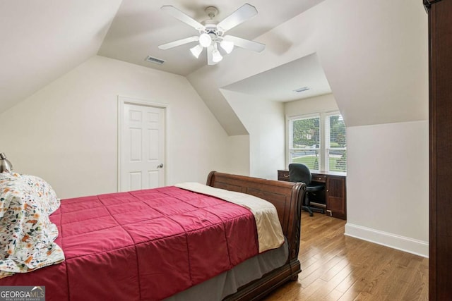 8970 Moor Park Run, Duluth, GA 30097 - bedroom featuring lofted ceiling, wood finished floors, ceiling fan, and an office area