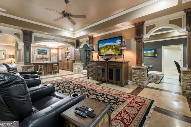 8970 Moor Park Run, Duluth, GA 30097 - living area featuring ornate columns, inlaid floor details, arched walkways, a ceiling fan, and crown molding