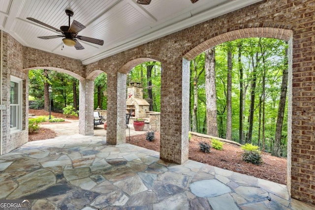 8970 Moor Park Run, Duluth, GA 30097 - view of patio with an outdoor brick fireplace and a ceiling fan