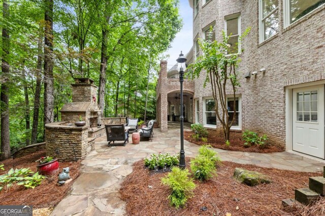 8970 Moor Park Run, Duluth, GA 30097 - view of home's community featuring a patio and an outdoor hangout area