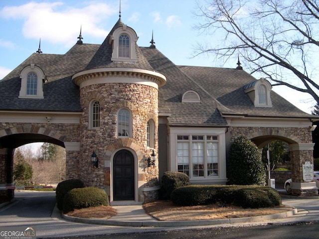 8970 Moor Park Run, Duluth, GA 30097 - view of front of home featuring stone siding and roof with shingles