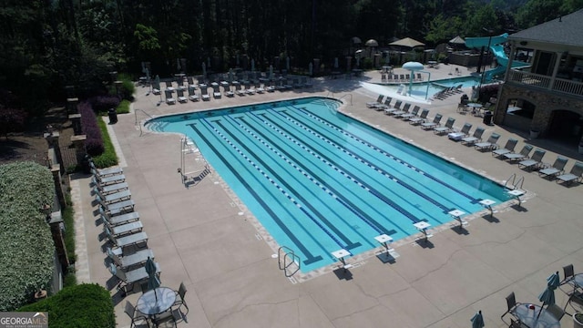 8970 Moor Park Run, Duluth, GA 30097 - community pool with a patio and a water slide