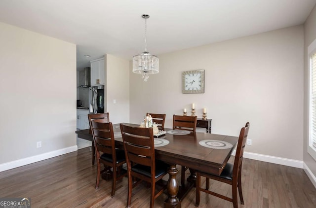 1270 Mccannon Morris Rd, Hull, GA 30646 - dining space featuring a chandelier, baseboards, and dark wood-style flooring