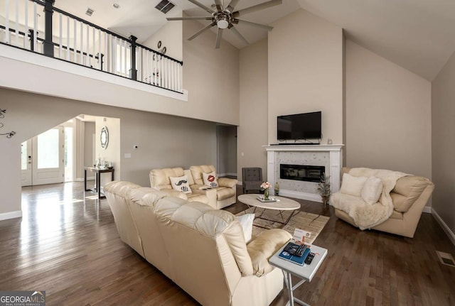 1270 Mccannon Morris Rd, Hull, GA 30646 - living room featuring ceiling fan, wood finished floors, high vaulted ceiling, a glass covered fireplace, and baseboards