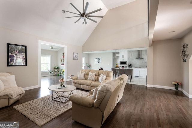 1270 Mccannon Morris Rd, Hull, GA 30646 - living room with ceiling fan, dark wood finished floors, high vaulted ceiling, and baseboards