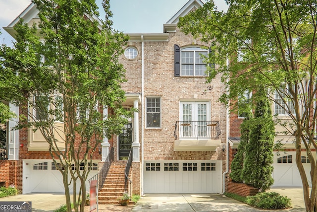 1040 Emory Parc Pl, Decatur, GA 30033 - multi unit property featuring an attached garage, driveway, and brick siding
