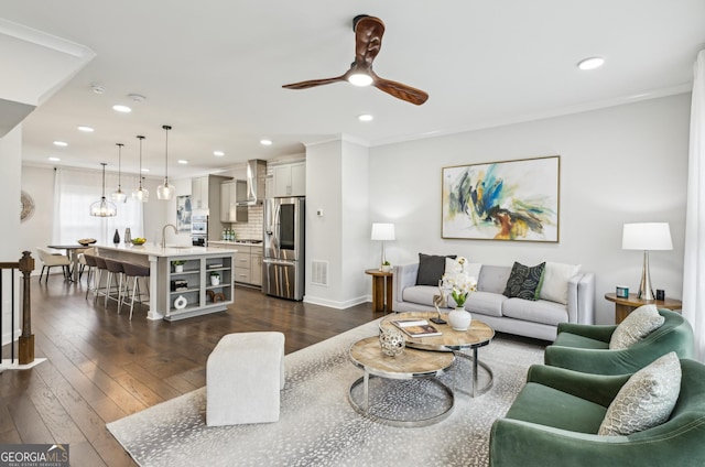 1174 City Park Ln, Decatur, GA 30033 - living room featuring ceiling fan, recessed lighting, dark wood-type flooring, baseboards, and ornamental molding