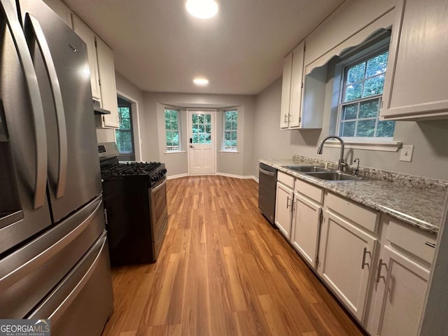80 Brooks Ln, Dallas, GA 30157 - kitchen with stainless steel appliances, light wood-style flooring, white cabinetry, and recessed lighting