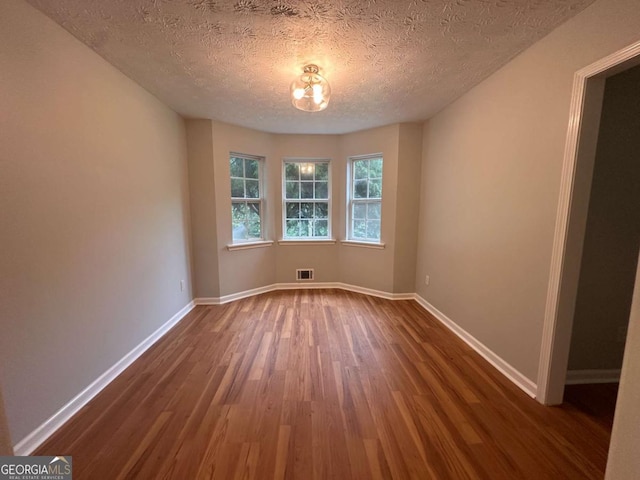 80 Brooks Ln, Dallas, GA 30157 - empty room with dark wood-style flooring and a textured ceiling