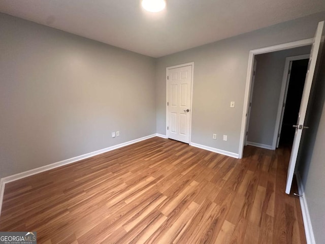 80 Brooks Ln, Dallas, GA 30157 - unfurnished bedroom featuring baseboards and wood finished floors