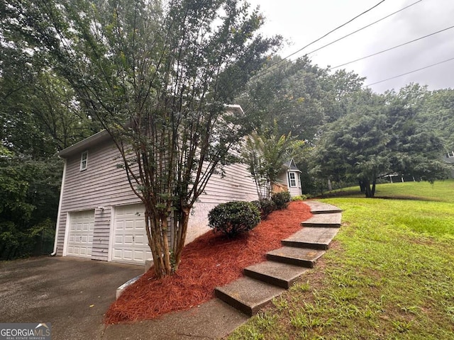 80 Brooks Ln, Dallas, GA 30157 - view of side of home featuring driveway, a yard, and an attached garage