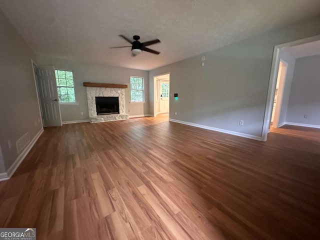 80 Brooks Ln, Dallas, GA 30157 - unfurnished living room with ceiling fan, wood finished floors, and a fireplace