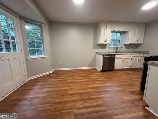80 Brooks Ln, Dallas, GA 30157 - kitchen featuring stainless steel dishwasher, white cabinetry, plenty of natural light, and range