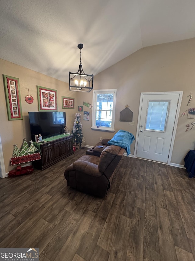 353 Mosley Rd, Vidalia, GA 30474 - living area with dark wood finished floors, a chandelier, vaulted ceiling, and baseboards