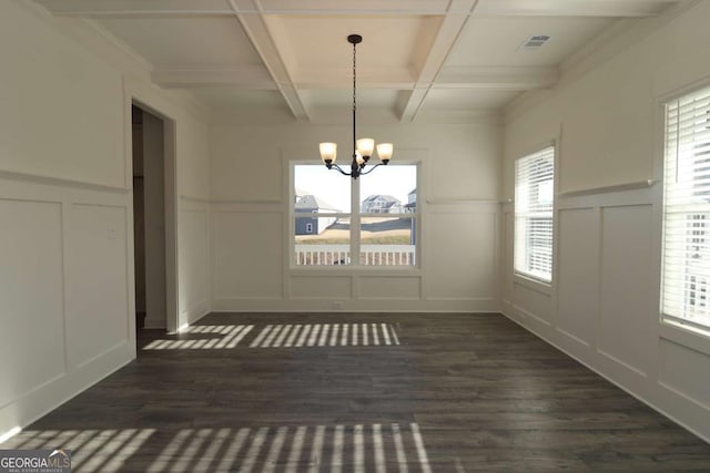 599 Calgary Downs Dr, Winder, GA 30680 - unfurnished dining area featuring a decorative wall, coffered ceiling, dark wood-type flooring, beamed ceiling, and a chandelier