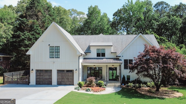 2756 Octavia Ln, Marietta, GA 30062 - modern inspired farmhouse with board and batten siding, a standing seam roof, driveway, a shingled roof, and an attached garage
