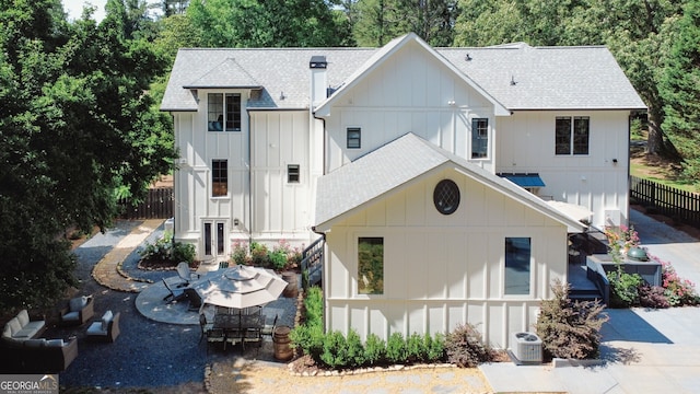 2756 Octavia Ln, Marietta, GA 30062 - back of house with roof with shingles, central air condition unit, board and batten siding, and a patio