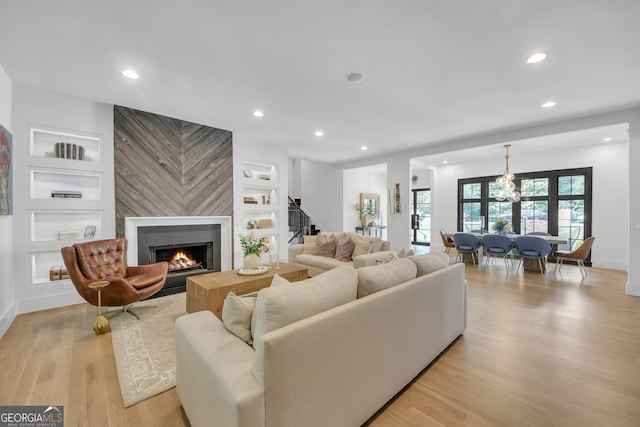 2756 Octavia Ln, Marietta, GA 30062 - living room featuring a fireplace, light wood finished floors, stairs, recessed lighting, and baseboards