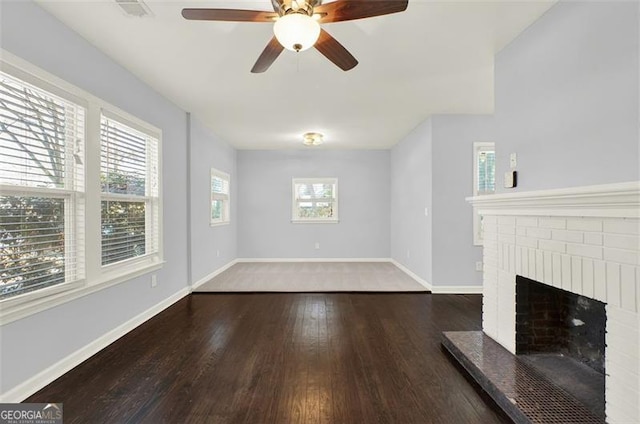 2505 Mellville Ave, Decatur, GA 30032 - unfurnished living room with wood finished floors, a fireplace, baseboards, and a ceiling fan