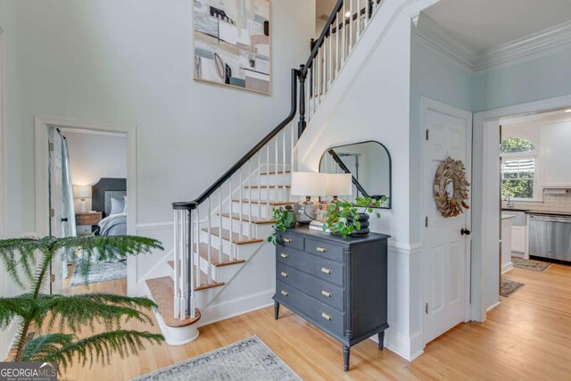 4402 Sugar Maple Pl, Gainesville, GA 30506 - staircase with wood finished floors, a high ceiling, and baseboards