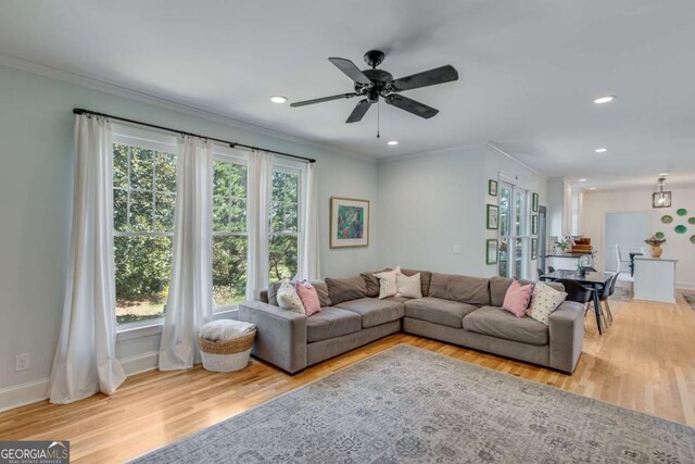 4402 Sugar Maple Pl, Gainesville, GA 30506 - living area featuring light wood-type flooring, ornamental molding, a ceiling fan, a fireplace with flush hearth, and recessed lighting