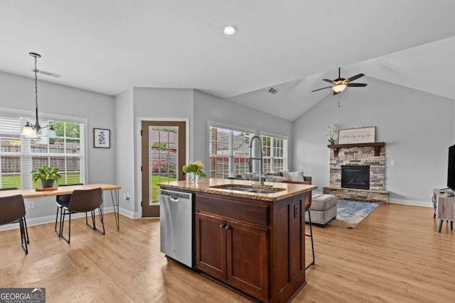 419 Highland Pointe Dr, Alto, GA 30510 - kitchen with dishwasher, light wood-type flooring, a fireplace, ceiling fan, and lofted ceiling