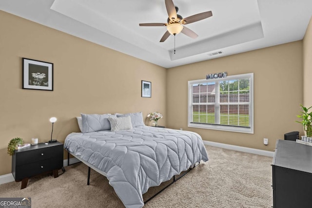 419 Highland Pointe Dr, Alto, GA 30510 - carpeted bedroom featuring a tray ceiling and baseboards