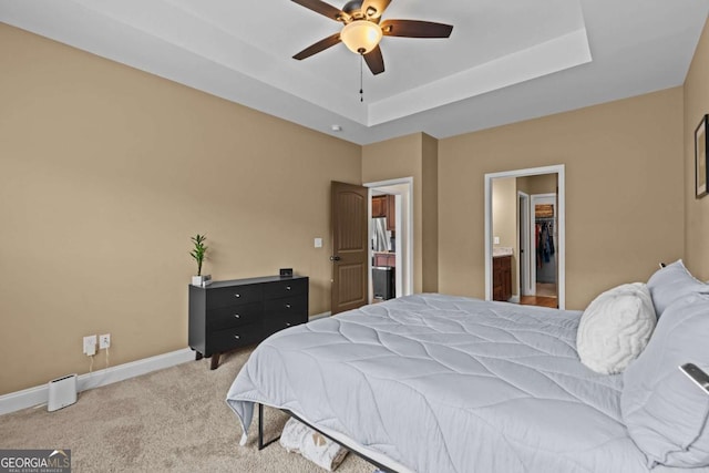 419 Highland Pointe Dr, Alto, GA 30510 - bedroom with carpet flooring, a spacious closet, a tray ceiling, and a ceiling fan