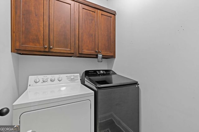 419 Highland Pointe Dr, Alto, GA 30510 - laundry room with washing machine and dryer and cabinet space