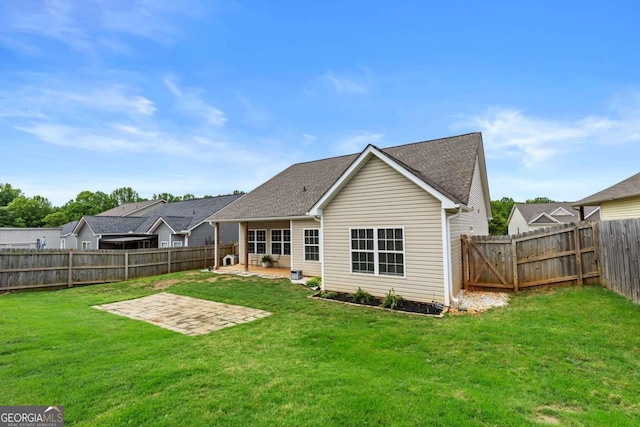 419 Highland Pointe Dr, Alto, GA 30510 - rear view of house with a patio, a fenced backyard, and a shingled roof