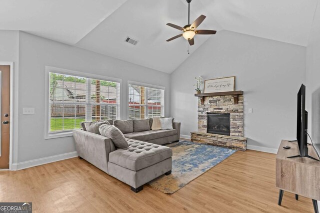 419 Highland Pointe Dr, Alto, GA 30510 - living area featuring a ceiling fan, wood finished floors, a fireplace, and high vaulted ceiling