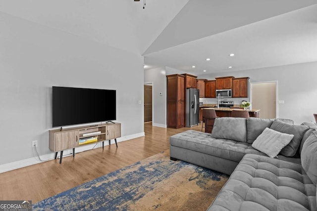 419 Highland Pointe Dr, Alto, GA 30510 - living area with recessed lighting, light wood-style floors, lofted ceiling, and a ceiling fan