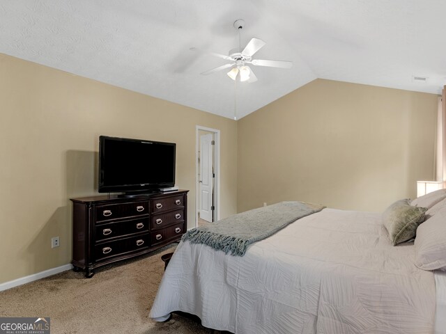 300 Furrow Creek Ct, Jackson, GA 30233 - bedroom featuring light carpet, lofted ceiling, a ceiling fan, and baseboards