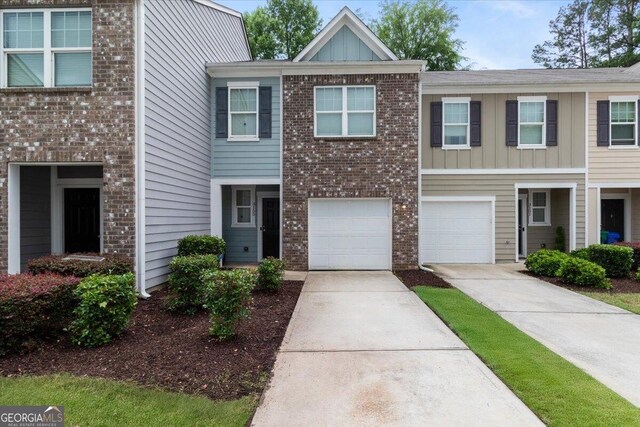 3155 Tarian Way, Decatur, GA 30034 - multi unit property with board and batten siding, concrete driveway, brick siding, and an attached garage