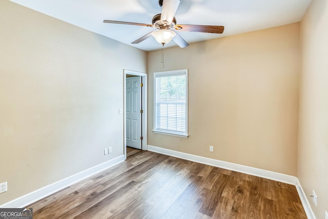 103 Mossy Creek Way, Ochlocknee, GA 31773 - empty room with ceiling fan, wood finished floors, and baseboards