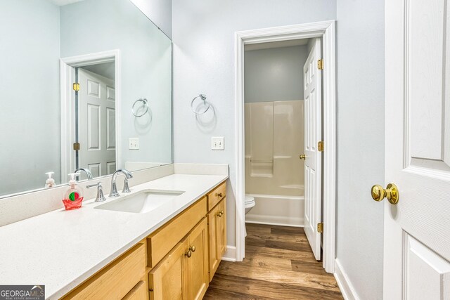 103 Mossy Creek Way, Ochlocknee, GA 31773 - bathroom featuring vanity, toilet, wood finished floors, and baseboards