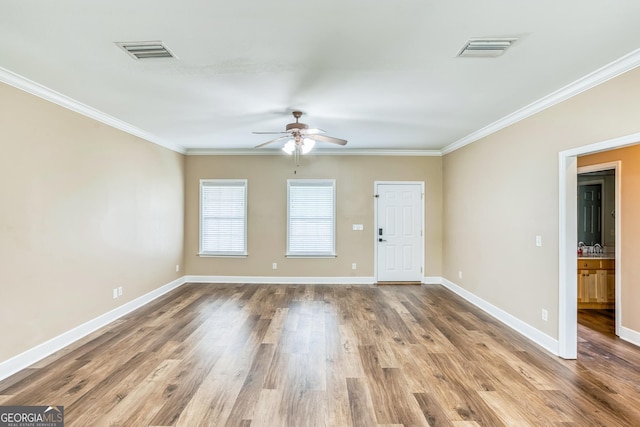 103 Mossy Creek Way, Ochlocknee, GA 31773 - empty room featuring a ceiling fan, ornamental molding, wood finished floors, and baseboards